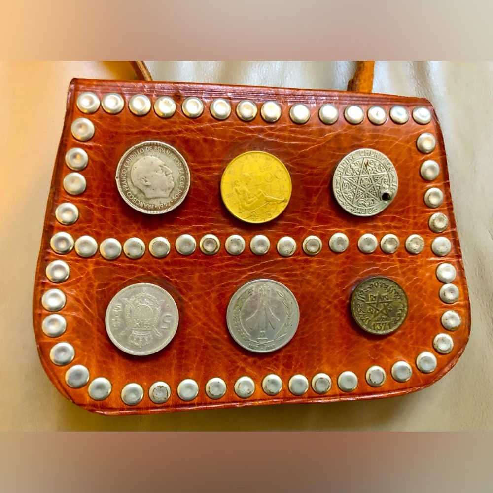 Vintage 60’s- 70’s handmade leather belt bag with authentic coins on belt.